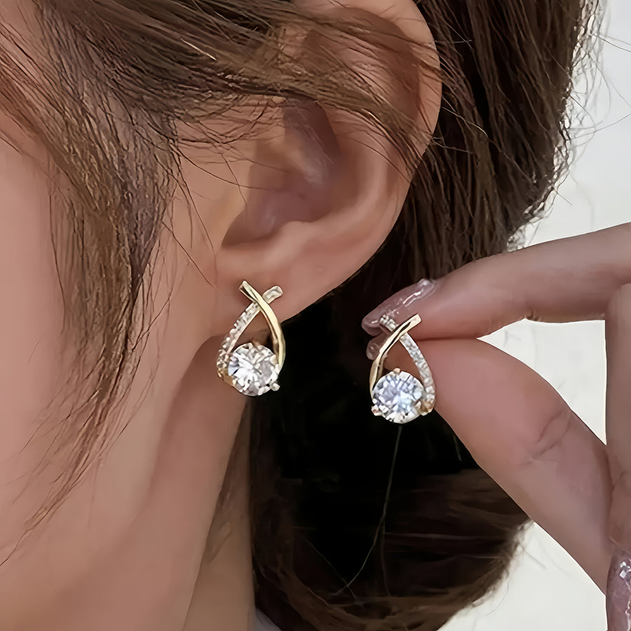 Boucles d'oreilles en puce avec croix dorée et zirconiums